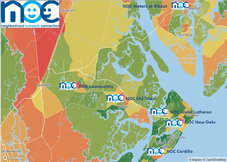 Portrait of a smiling middle-aged woman with brown hair.